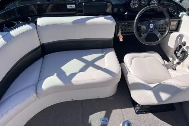 Slide: The Image of 1996 MasterCraft ProStar 190 interior with white seating and steering wheel. - 11