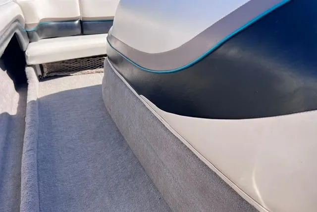 Slide: The Image of 1996 MasterCraft ProStar 190 interior with blue and white upholstery details. - 19