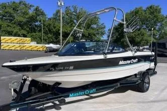 Slide: The Image of 1996 MasterCraft ProStar 190 boat on trailer in outdoor setting. - 6