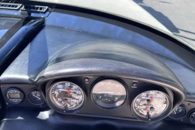 Slide: The Image of Dashboard of a 1996 MasterCraft ProStar 190 boat with gauges and controls. - 16
