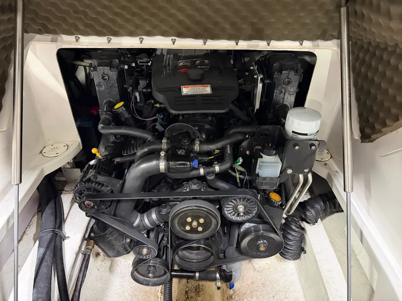 Slide: The Image of The engine compartment of a 2006 Crownline 220 EX shows a well-maintained engine with various components. - 19