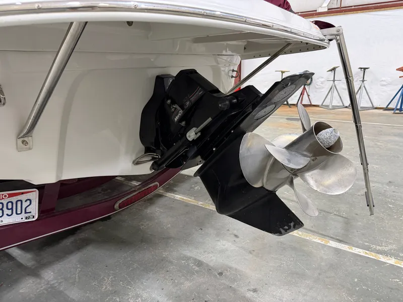 Slide: The Image of Close-up of a 2006 Crownline 220 EX boat's drive in a storage facility. - 22