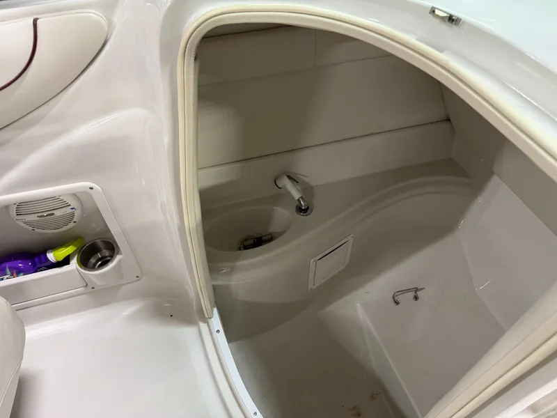 Slide: The Image of The image shows the interior of a boat with a small sink and storage area. - 17