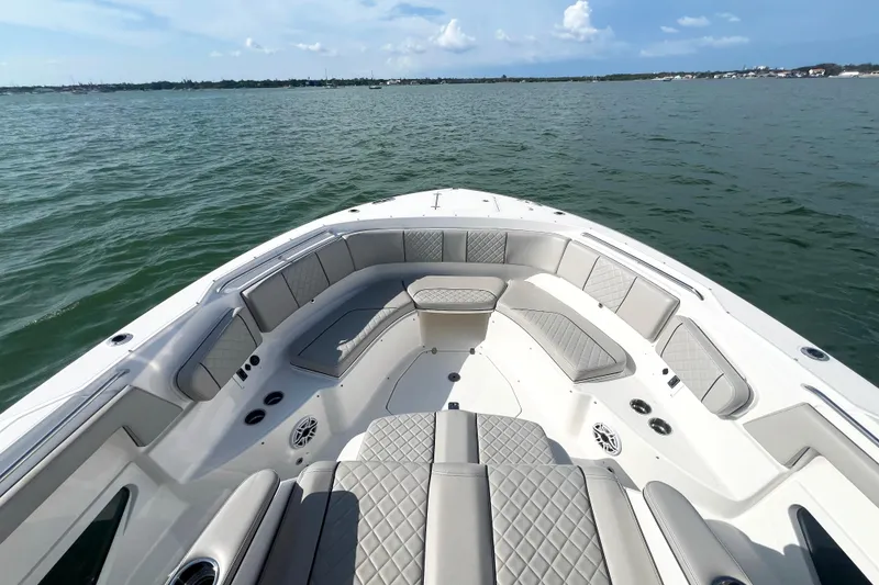 Slide: The Image of 2023 Pursuit S 378 Sport boat with luxurious seating on calm waters. - 42