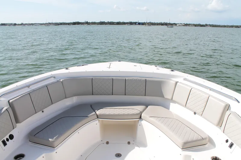 Slide: The Image of 2023 Pursuit S 378 Sport boat with spacious seating, overlooking calm waters. - 43
