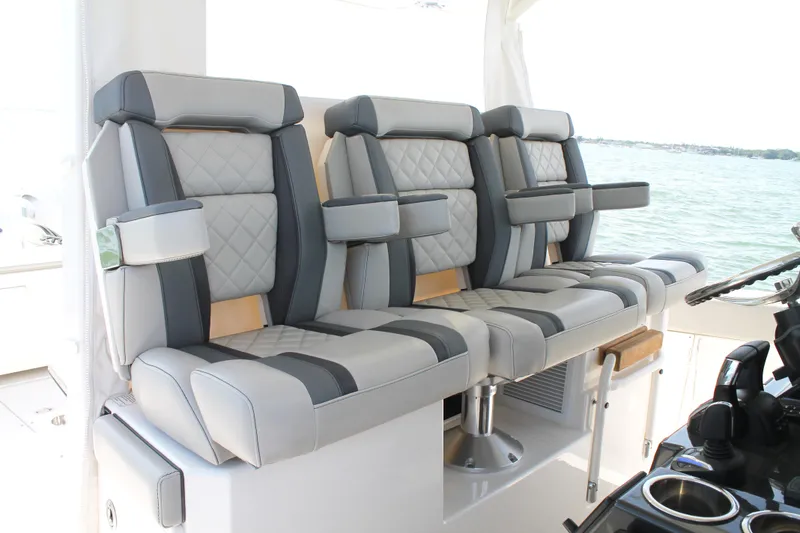 Slide: The Image of Luxurious seating on 2023 Pursuit S 378 Sport boat, featuring elegant gray upholstery. - 31