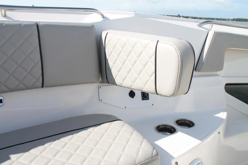 Slide: The Image of Luxurious seating on 2023 Pursuit S 378 Sport boat with quilted upholstery and cup holders. - 47
