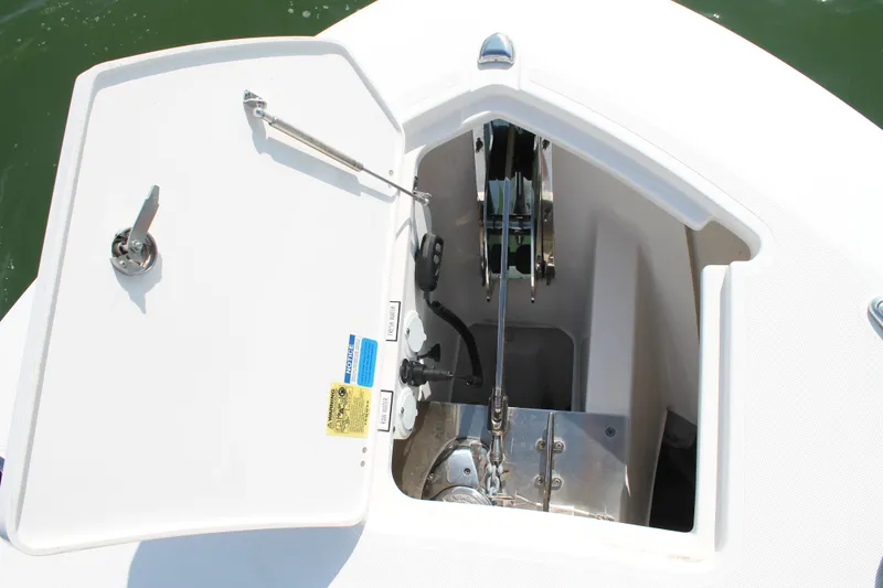 Slide: The Image of 2023 Pursuit S 378 Sport boat anchor compartment with open hatch. - 50