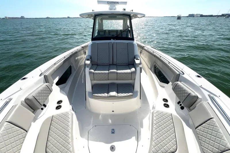 Slide: The Image of 2023 Pursuit S 378 Sport boat with luxurious seating on open water. - 44