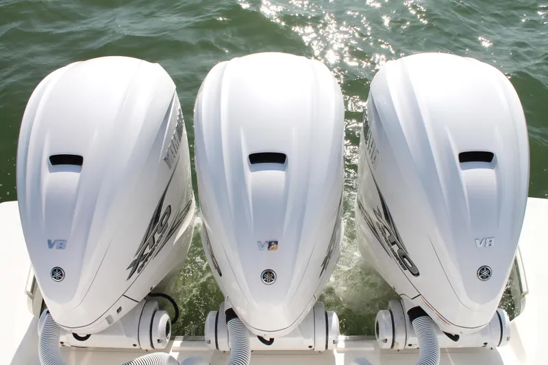 Slide: The Image of Triple Yamaha V8 outboard engines on a 2023 Pursuit S 378 Sport boat. - 13