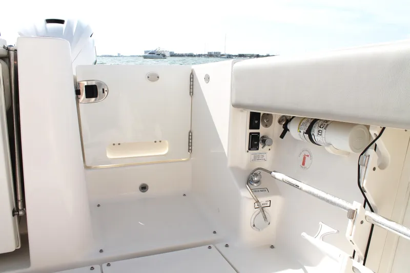 Slide: The Image of 2023 Pursuit S 378 Sport boat interior with safety equipment and controls. - 22