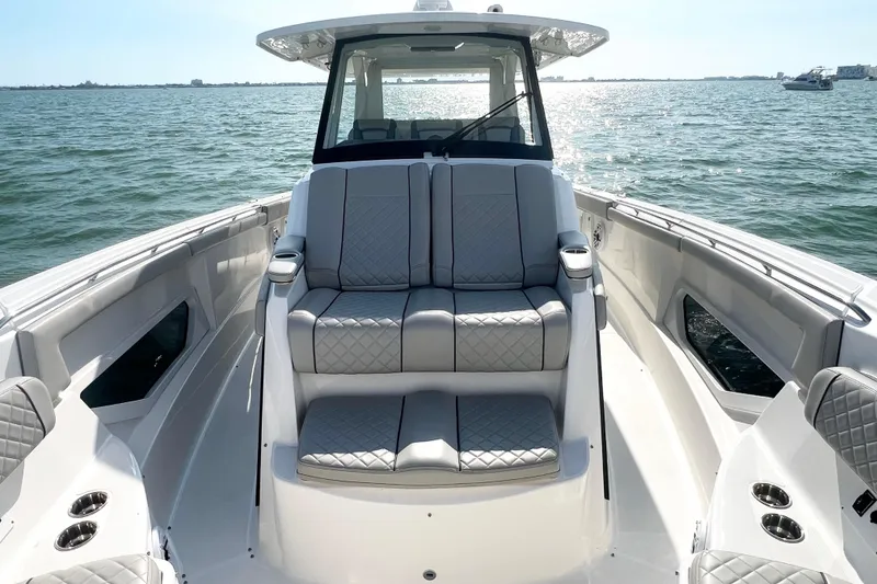 Slide: The Image of 2023 Pursuit S 378 Sport boat with luxurious seating on open water. - 45