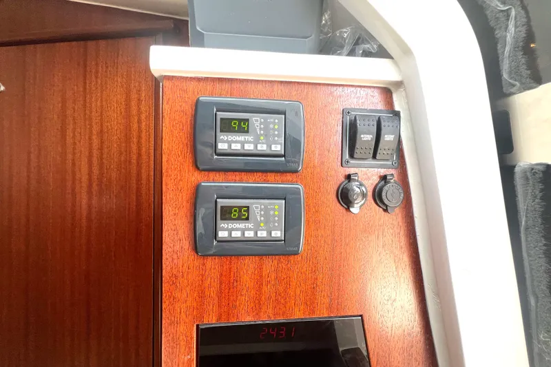 Slide: The Image of Control panel on 2023 Pursuit S 378 Sport boat with Dometic displays and switches. - 55