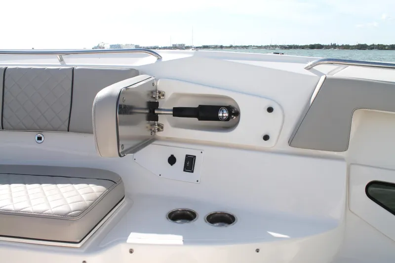 Slide: The Image of 2023 Pursuit S 378 Sport boat interior with seating and cup holders. - 49