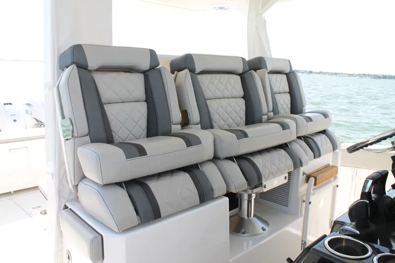 Slide: The Image of Luxury seating on 2023 Pursuit S 378 Sport boat, featuring quilted upholstery. - 30