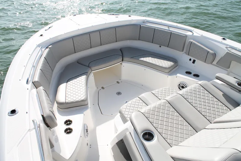 Slide: The Image of Luxurious seating on 2023 Pursuit S 378 Sport boat, featuring quilted upholstery and cup holders. - 41