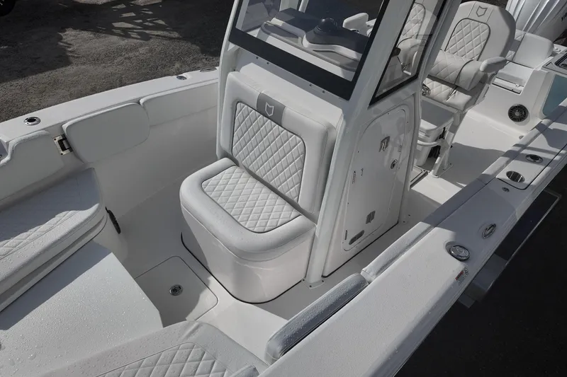 Slide: The Image of 2026 Sea Fox 248 Commander boat interior with cushioned seating and console. - 9