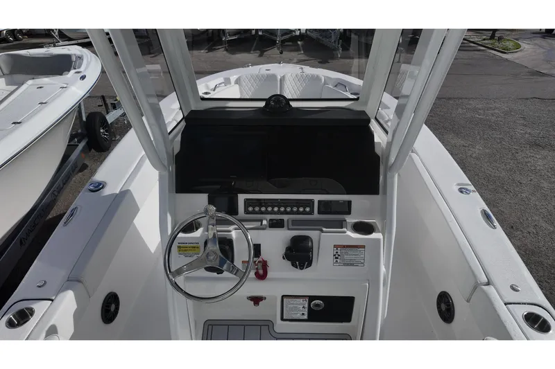 Slide: The Image of 2026 Sea Fox 248 Commander boat cockpit with steering wheel and control panel. - 5