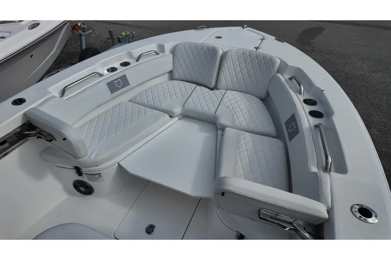 Slide: The Image of 2026 Sea Fox 248 Commander boat interior with cushioned seating and cup holders. - 7