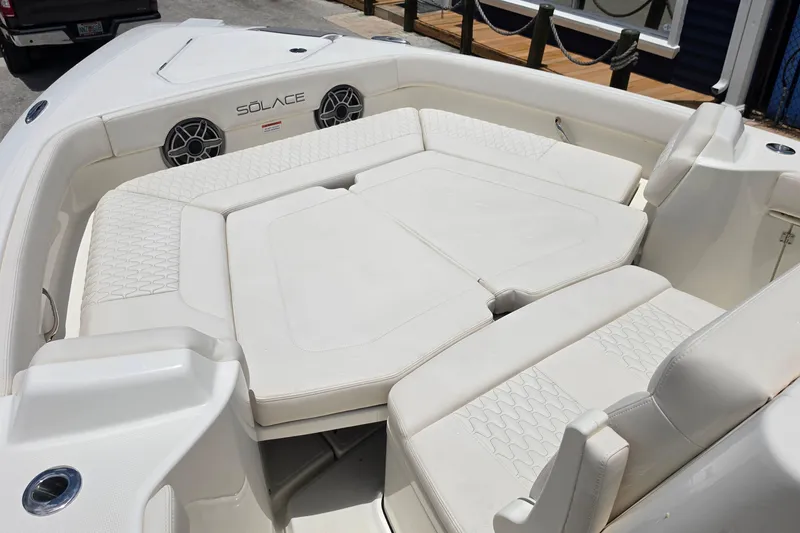 Slide: The Image of Luxurious seating area on a 2027 Solace 28HCS boat, featuring comfortable white cushions. - 17