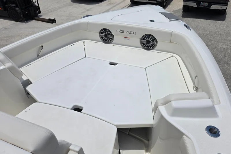 Slide: The Image of 2027 Solace 28HCS boat interior with spacious seating and integrated speakers. - 19