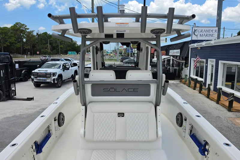 Slide: The Image of 2027 Solace 28HCS boat at Grander Marine dealership, showcasing sleek design and modern features. - 9
