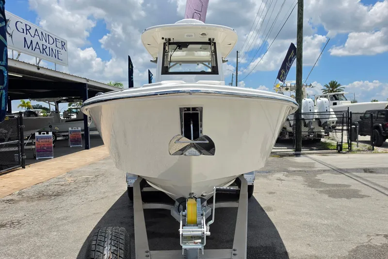 Slide: The Image of 2027 Solace 28HCS boat on trailer at Grander Marine dealership. - 8