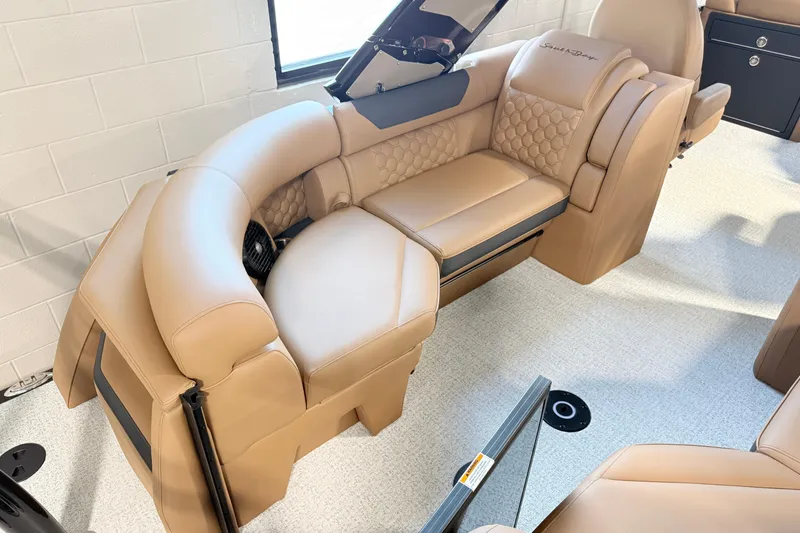 Slide: The Image of Luxurious tan seating in 2026 South Bay 525RS DC boat interior. - 11