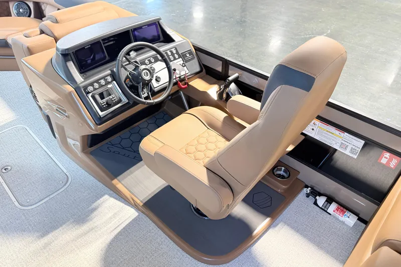 Slide: The Image of Luxurious helm of 2026 South Bay 525RS DC boat with modern controls and seating. - 15
