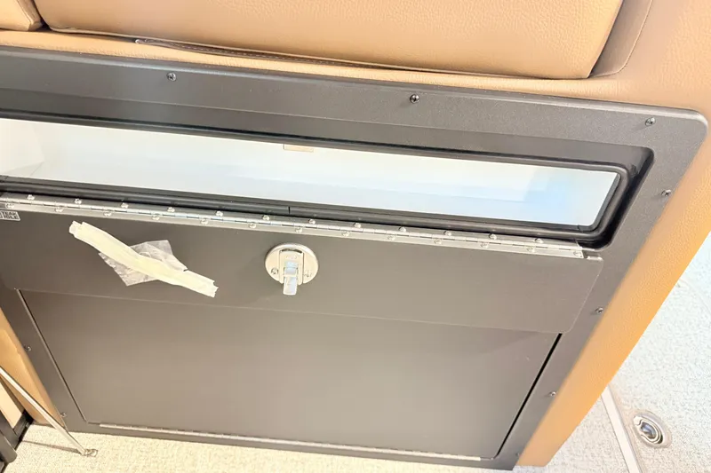 Slide: The Image of 2026 South Bay 525RS DC interior compartment with lock and taped handle. - 5