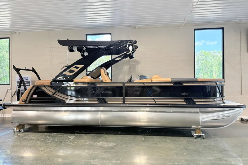 The Image of 2026 South Bay 525RS DC pontoon boat in showroom, featuring sleek design and modern amenities. - 0
