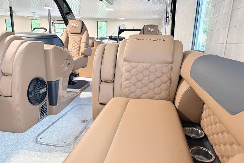 Slide: The Image of Luxurious interior of 2026 South Bay 525RS DC boat with tan leather seating. - 21