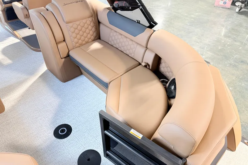 Slide: The Image of Luxurious tan seating in 2026 South Bay 525RS DC boat interior. - 12