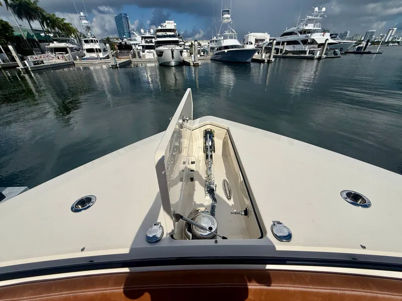Slide: The Image of Scout 530 LXF 2024 docked with other boats in the background. - 23