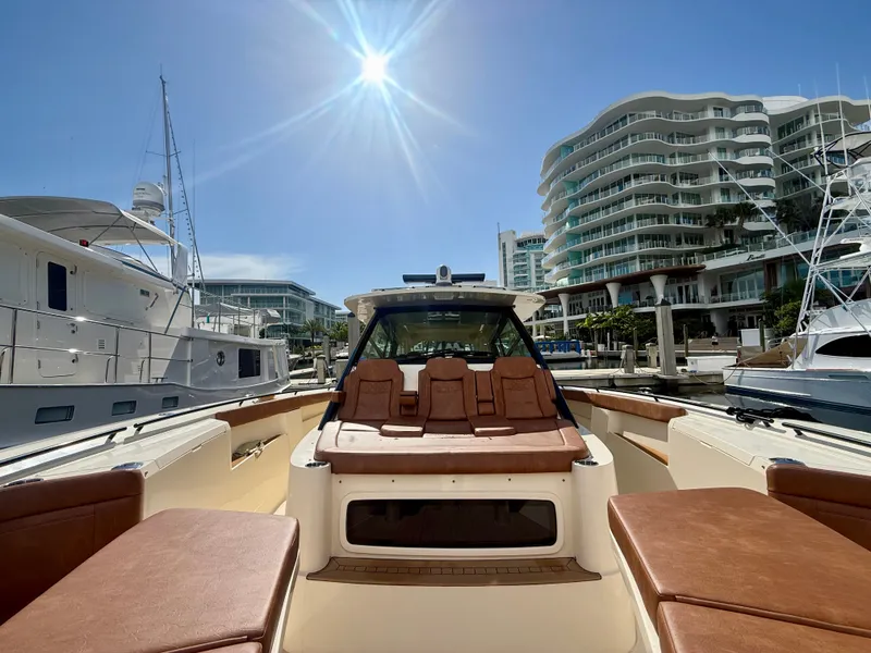 Slide: The Image of Scout 530 LXF 2024 docked with modern buildings in the background. - 9