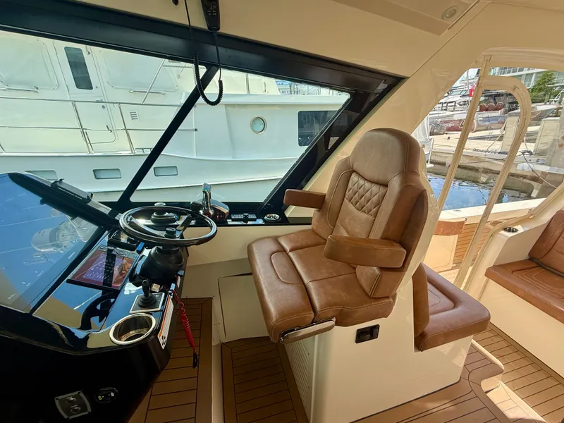 Slide: The Image of Interior view of a luxury boat with leather seat and helm console. - 1