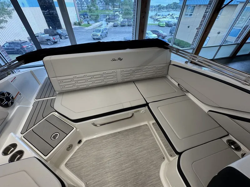 Slide: The Image of The image shows the interior of a Sea Ray SPX 210 boat with sleek seating and modern details. - 6