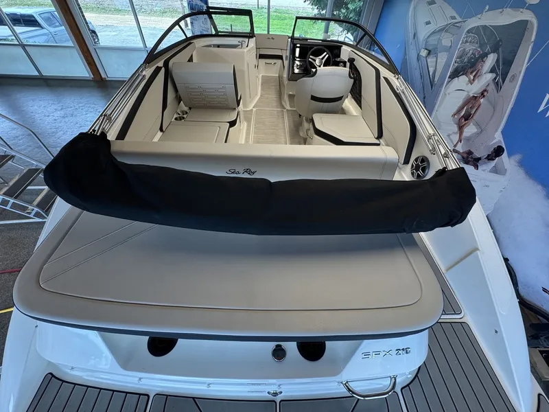 Slide: The Image of The image shows the stern of a 2026 Sea Ray SPX 210 boat with sleek seating. - 3