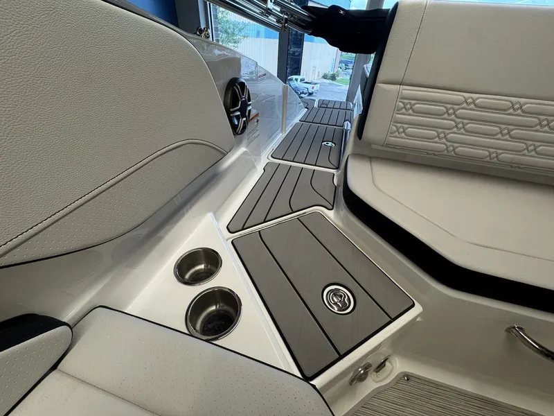 Slide: The Image of The image shows the interior of a Sea Ray SPX 210 boat with sleek gray and white upholstery. - 8