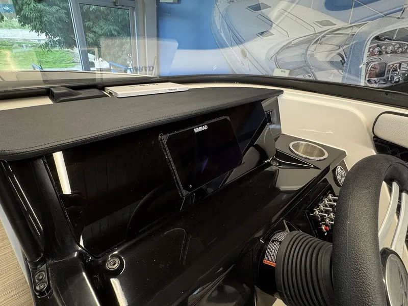 Slide: The Image of The image shows the dashboard of a Sea Ray SPX 210 boat with a modern display. - 11
