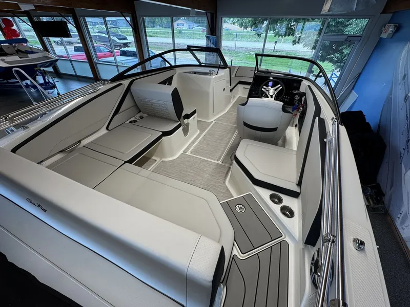 Slide: The Image of Interior view of a modern Sea Ray SPX 210 boat with sleek seating and helm console. - 5
