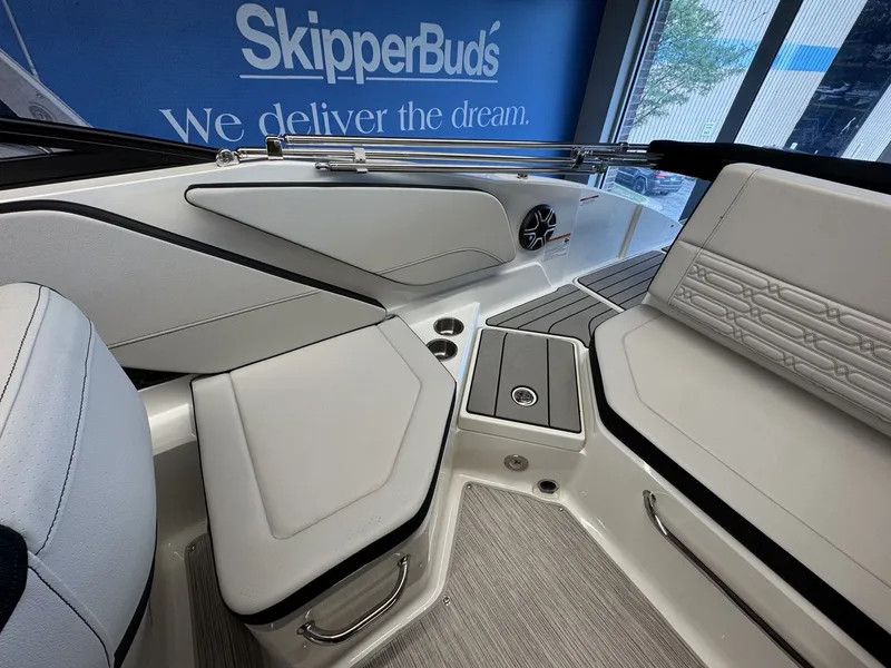 Slide: The Image of Interior view of a Sea Ray SPX 210 boat with sleek white seating and modern details. - 7