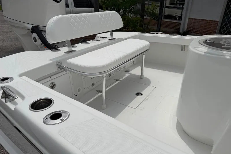 Slide: The Image of 2026 BlackJack 256 Coastal boat interior with white seating and fishing rod holders. - 15