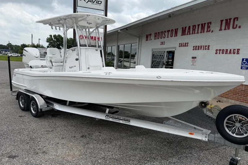 Slide: The Image of 2026 BlackJack 256 Coastal boat on trailer at Mt. Houston Marine dealership. - 2