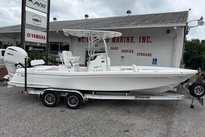 The Image of 2026 BlackJack 256 Coastal boat on trailer at marine dealership, featuring Yamaha engine. - 0
