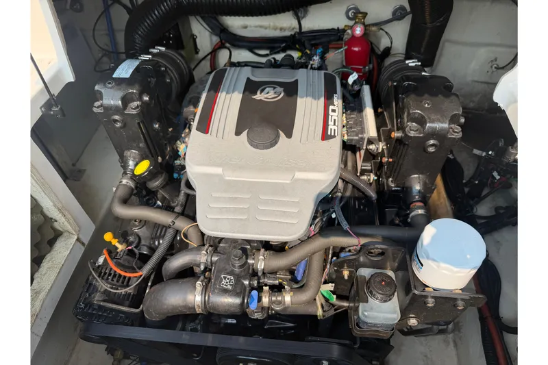 Slide: The Image of Engine of a 2009 Sea Ray 240 Sundeck boat, featuring a 350 MAG motor. - 7
