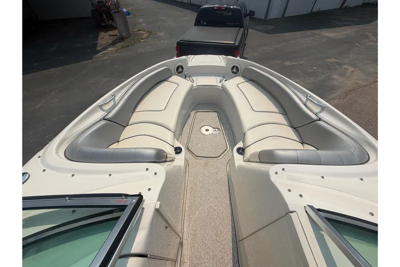 Slide: The Image of 2009 Sea Ray 240 Sundeck boat interior with spacious seating and sleek design. - 10