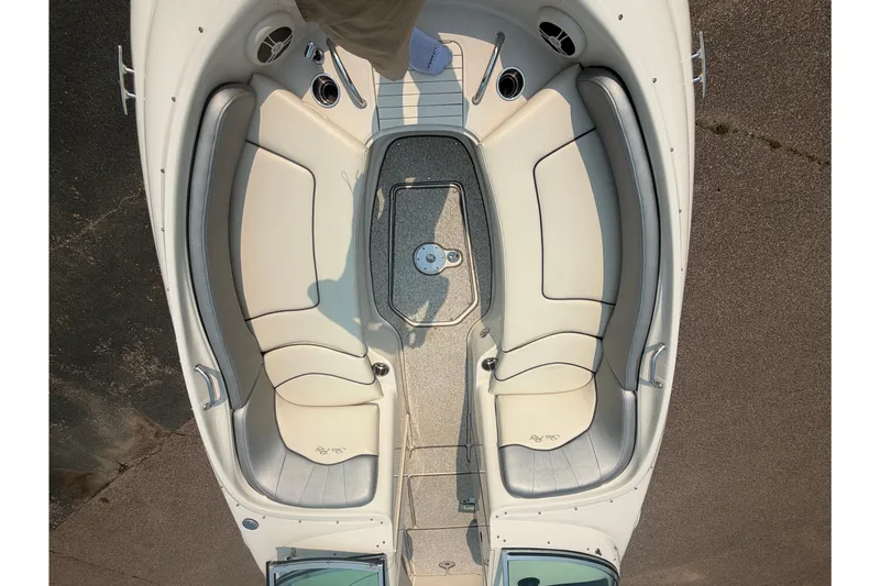 Slide: The Image of Top view of 2009 Sea Ray 240 Sundeck boat interior with beige seating. - 13
