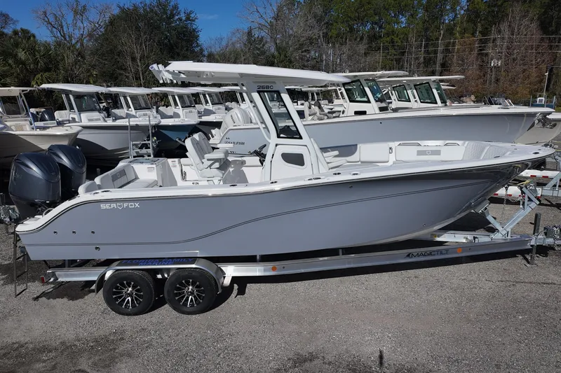Slide: The Image of 2026 Sea Fox 268 Commander boat on trailer, displayed outdoors. - 1