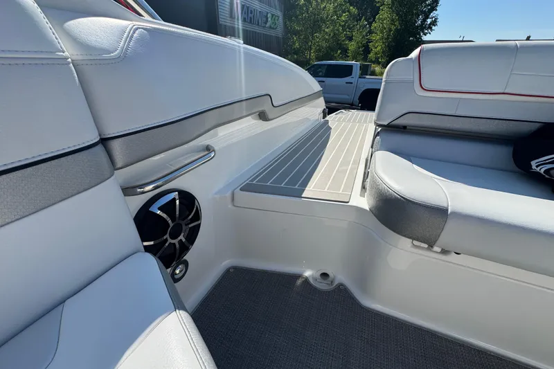 Slide: The Image of 2018 Formula 270 Bowrider interior with white seating and speaker detail. - 11